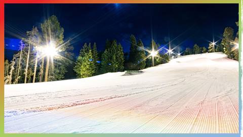 A groomed run at Snow Summit lit up with lights for a night session